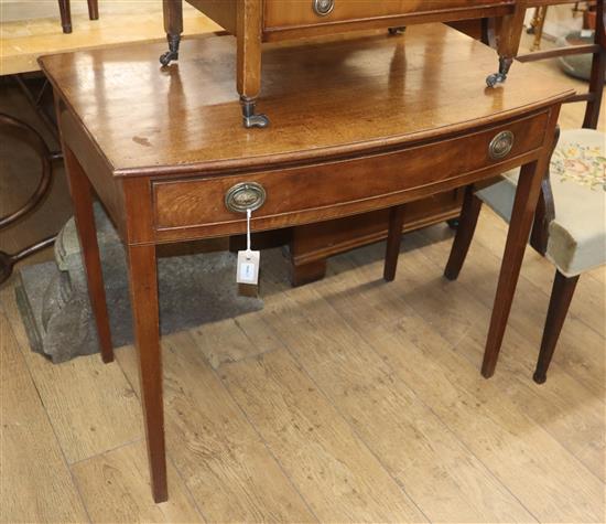 A Regency mahogany bow-fronted side table fitted drawers on tapered legs W.90cm